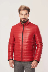 Man wearing a red puffer jacket on a white background