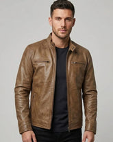 Man wearing a brown leather jacket on a gray background