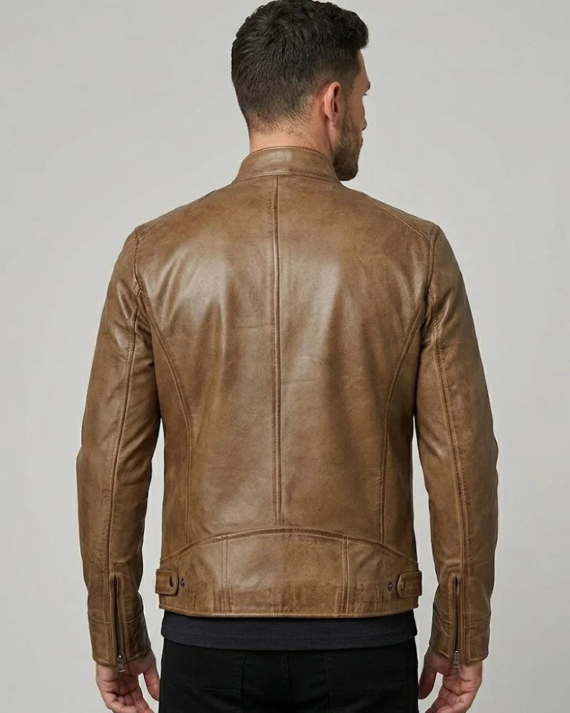 Man wearing a brown leather jacket on a plain background
