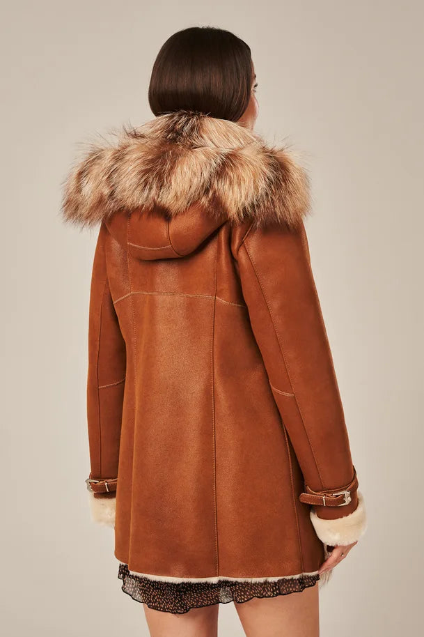 Brown suede coat with fur hood on a neutral background